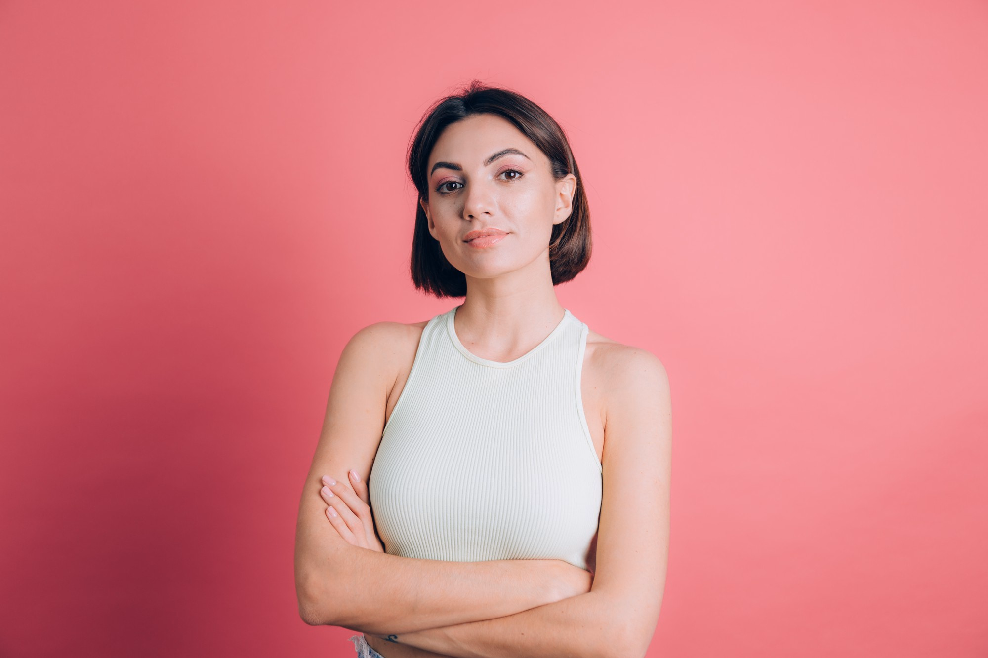 Testimonial portrait on a pink studio backdrop