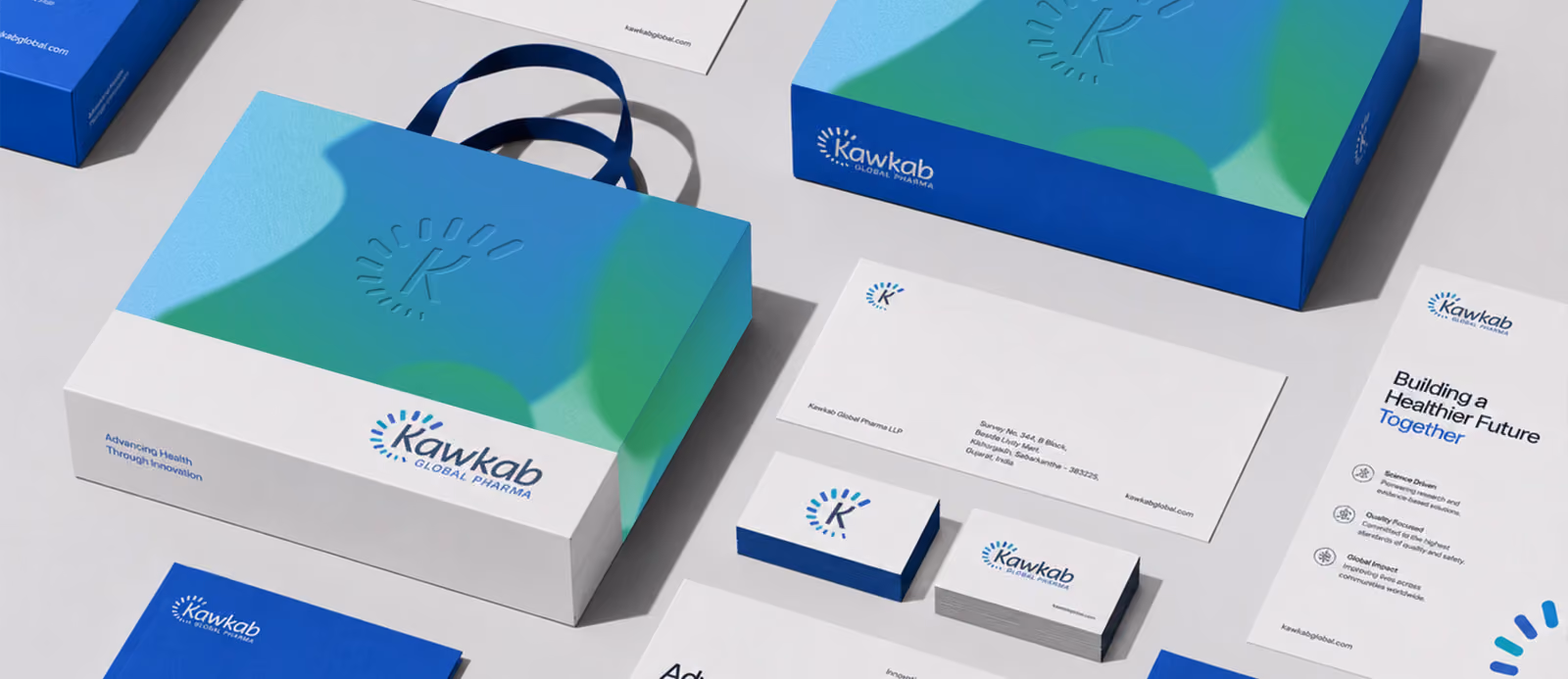 Full stationery flatlay: boxes, bags, business cards and letterhead